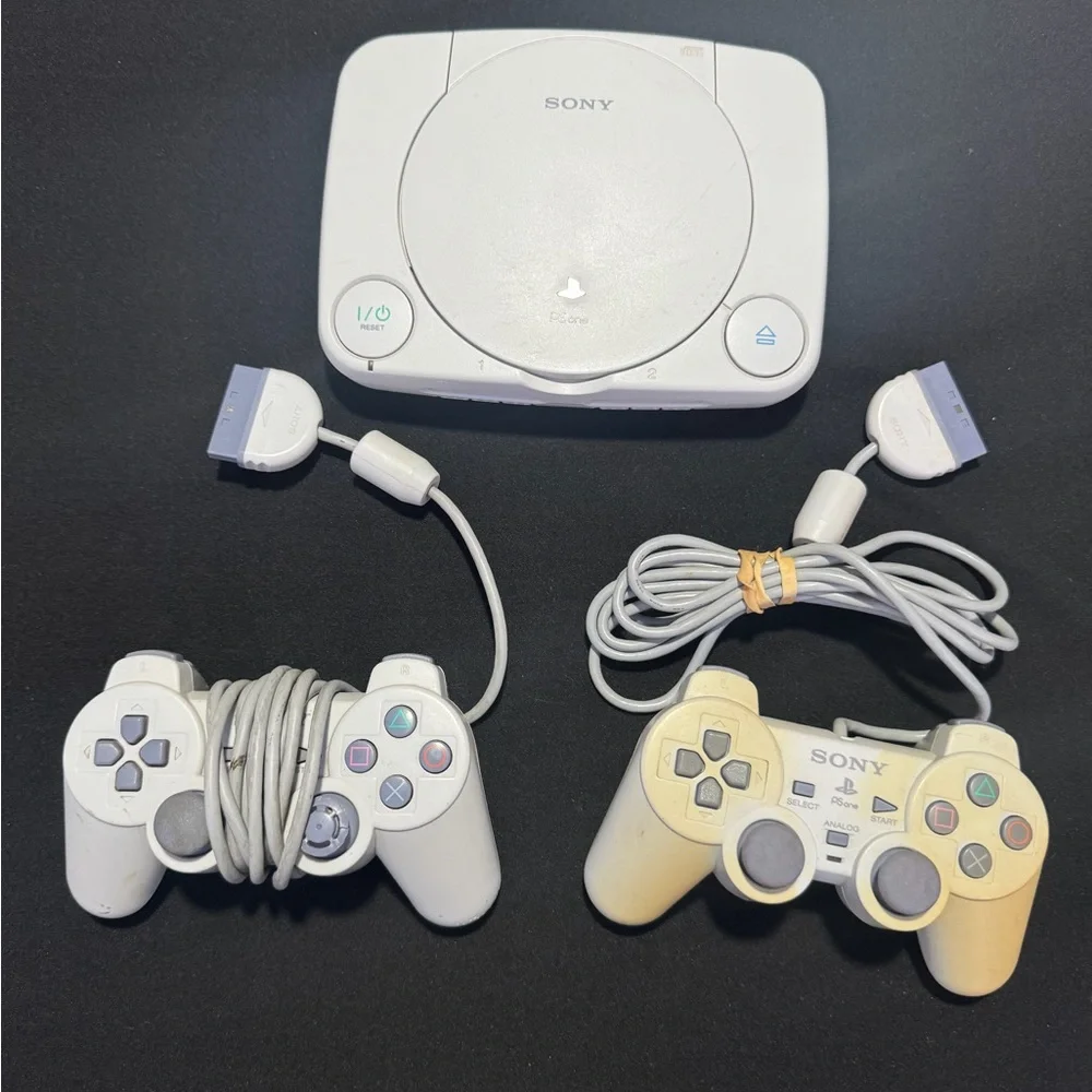 Sony PlayStation Console with Dual Gray Controllers